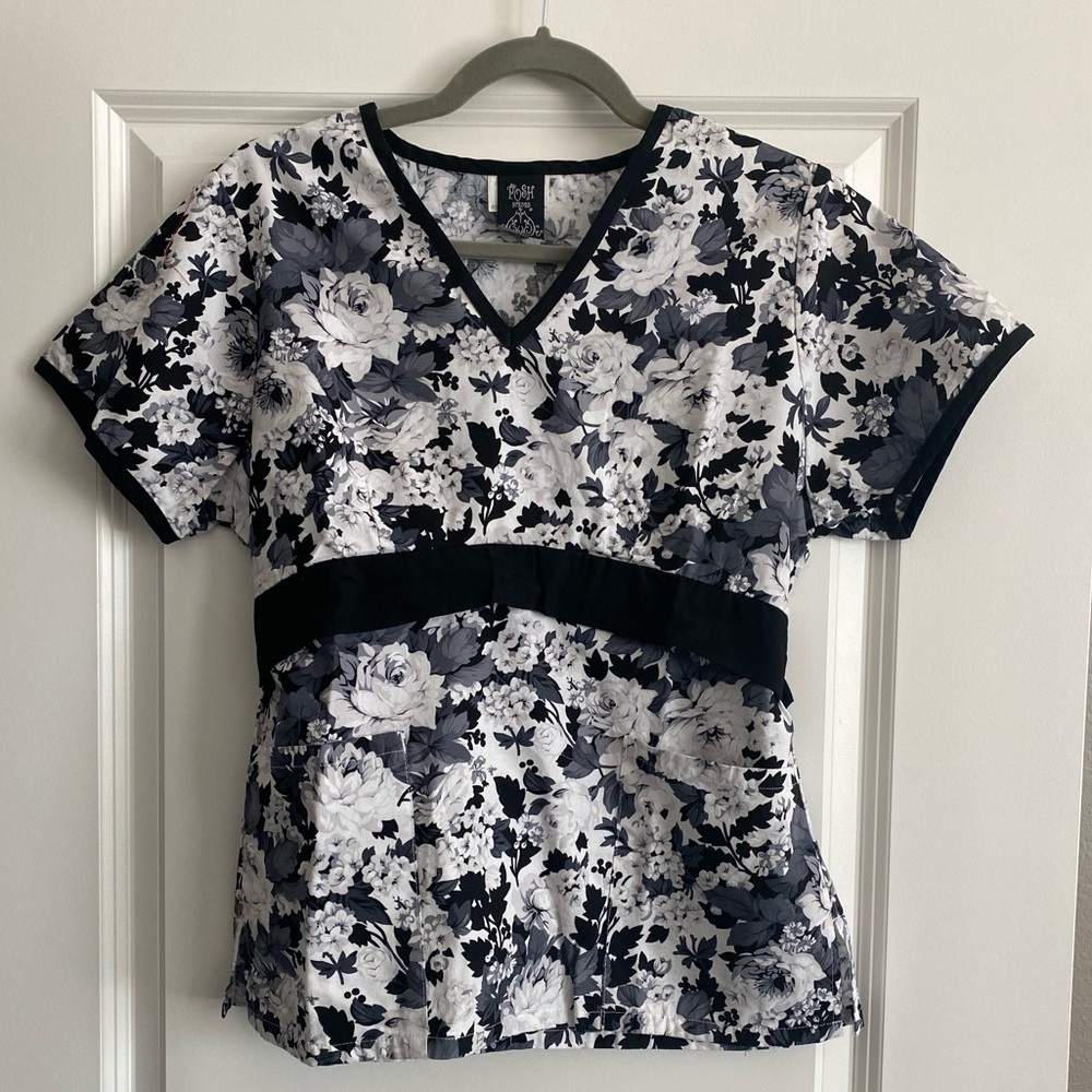 Women’s white and black floral scrub top.